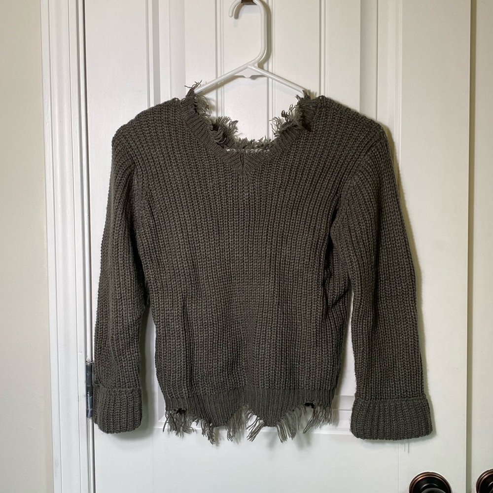 Womens/Juniors grey ripped sweater. Size XS. EUC